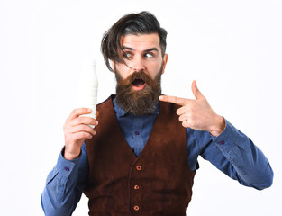 bearded man holding bottle of kefir with surprised face