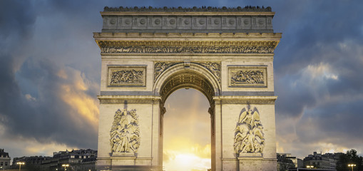 View of famous Arc de Triomphe at sunset