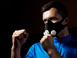 Man boxing in training mask