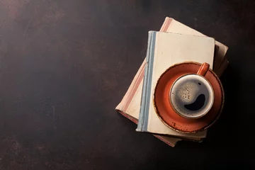 Zelfklevend Fotobehang Coffee cup on books © karandaev