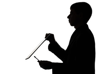 Silhouette of a man with a folder and a pen
