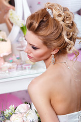 Obraz na płótnie Canvas Beautiful bride with fashion wedding hairstyle . Hairstyle back view