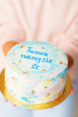 Delicious birthday cake on woman hands. Birthday concept.