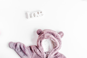 Baby clothes and toys on white background top view mock up