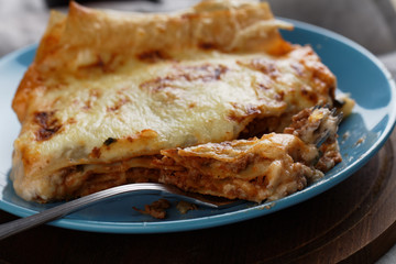 Lasagna Bolognese on a rustic table