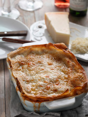 Lasagna Bolognese on a rustic table