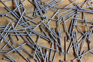 roofing nails scattered on the wooden flooring.