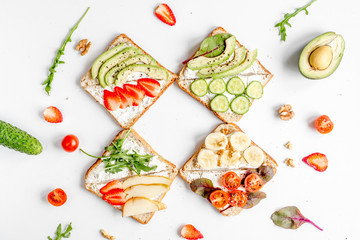 fitness breskfast with homemade sandwiches white table background top view