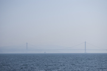 Fototapeta na wymiar Osman Gazi Bridge at foggy day summer travel
