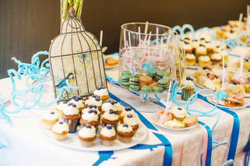 cakes, macaroon and cookies on the sweet table