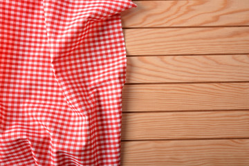 Red and white checkered fabric on wood table top