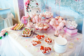cakes, macaroon and cookies on the sweet table