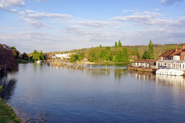 Fototapeta na wymiar The River Thames at Marlow in Buckinghamshire including the weir to the right