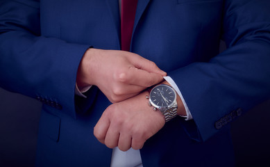 Businessman improving his outfit before the meeting