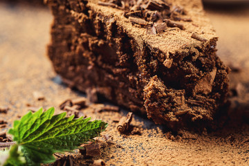 chocolate cake with Candies,Chocolate cake with a cut piece and blade on gray background, closeup,Dark chocolate cake,Delicious vegan chocolate cake,Tasty chocolate cake on wooden background
