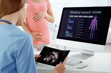 Gynecology consultation. Doctor showing results of diagnosis
