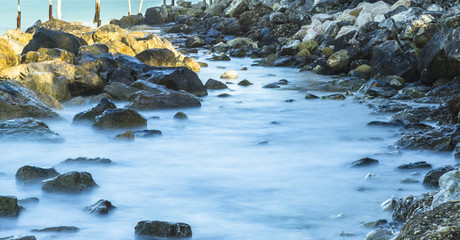 Long exposure shot of Italian rock beach