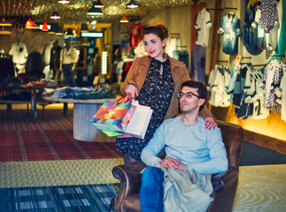 Woman and man in clothing store