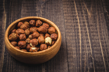 wooden bowl with nut a filbert with a blank space for the text/wooden bowl with nut a filbert