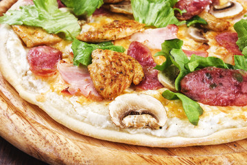 Close-up pizza with ham and mushrooms