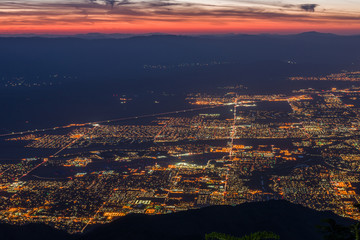 Sunrise over Palm Springs, California with web of street lights -3