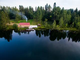 Fototapeta na wymiar House by the lake, view from the air