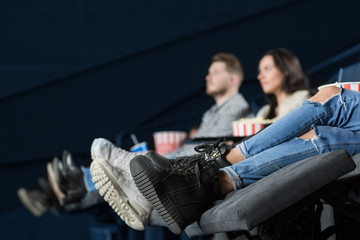 Happy young couple having a date at the cinema