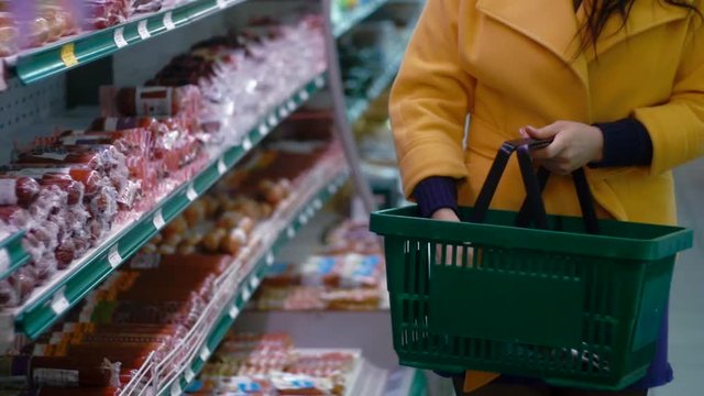 woman buys a sausage