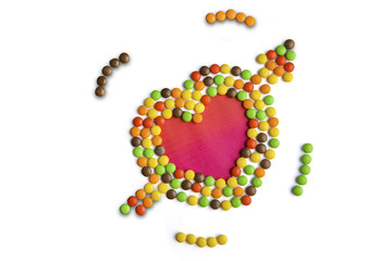 Multi colored candies shaped heart symbol