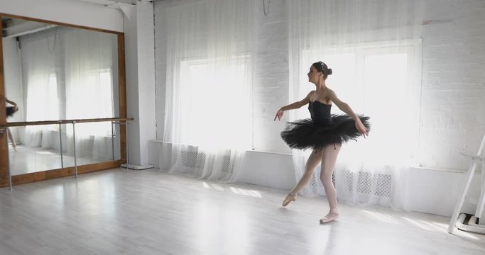 graceful girl practicing ballet in the Studio