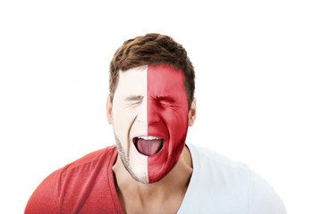 Screaming man with Malta flag on face.