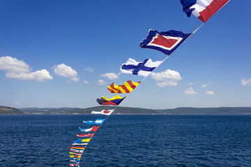 Set of the marine alarm flags on a mast.