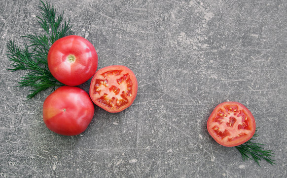 Pink Tomatoes On Stone Table