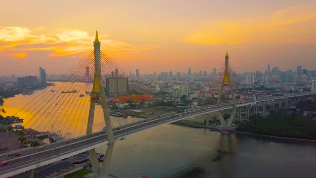 Beautiful sunset view from a drone of Bhumibol Bridge in Bangkok , Bridge of transportation for import , export , Bangkok ,Thailand

