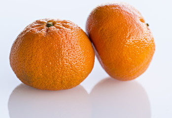two oranges in studio with white background
