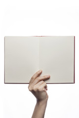 woman hand hold a red book isolated white.