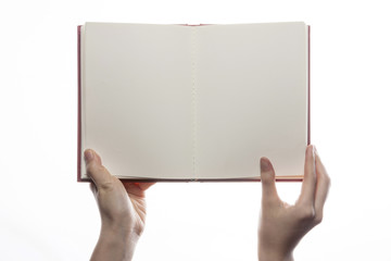 woman hand hold a red book isolated white.