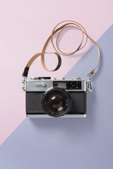 retro hipster poster or card with vintage camera on a dichromatic pastel colored paper background,...