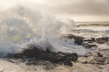Ocean Waves Crashing into Rocky Shore
