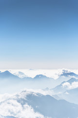 Obraz na płótnie Canvas Beautiful mountain ridge in the clouds - Fansipan Mountain in Vietnam