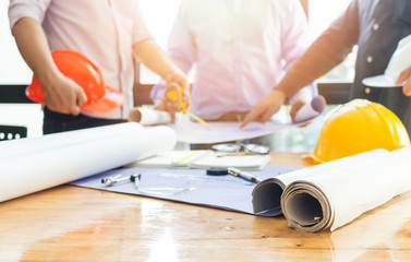 Image of male hand pointing at business document during discussion at meeting