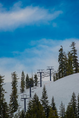 Ski Lift with snow on mountain in spring time