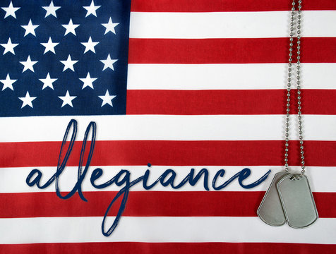 word allegiance and military dog tags on American flag background