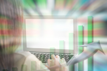 Motion blur of asian woman work with computer on blurred chart and stock board background in business concept