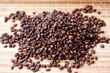 Fragrant coffee beans close-up on solar pleasant uniform light