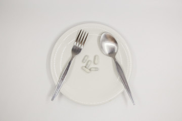 Capsule on white dish