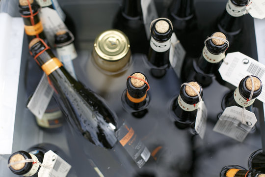cava bottles in a bucket of water