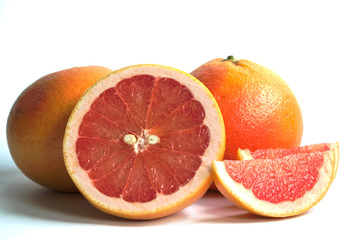 Closeup of red grapefruits on a white background
