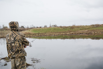 fishing on a spinning. catching of predatory fish. a pike on a spinning