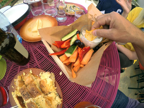 Crispy tortilla chips in a yogurt dip with fresh vegetable